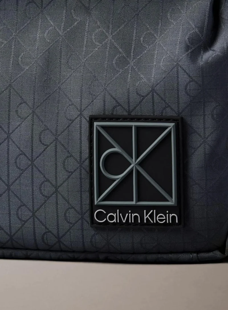 Calvin Klein SLATE BLUE AS SWATCH SENT Allover Emblem Logo Jacquard Reporter Bag for Men | Best Price UAE