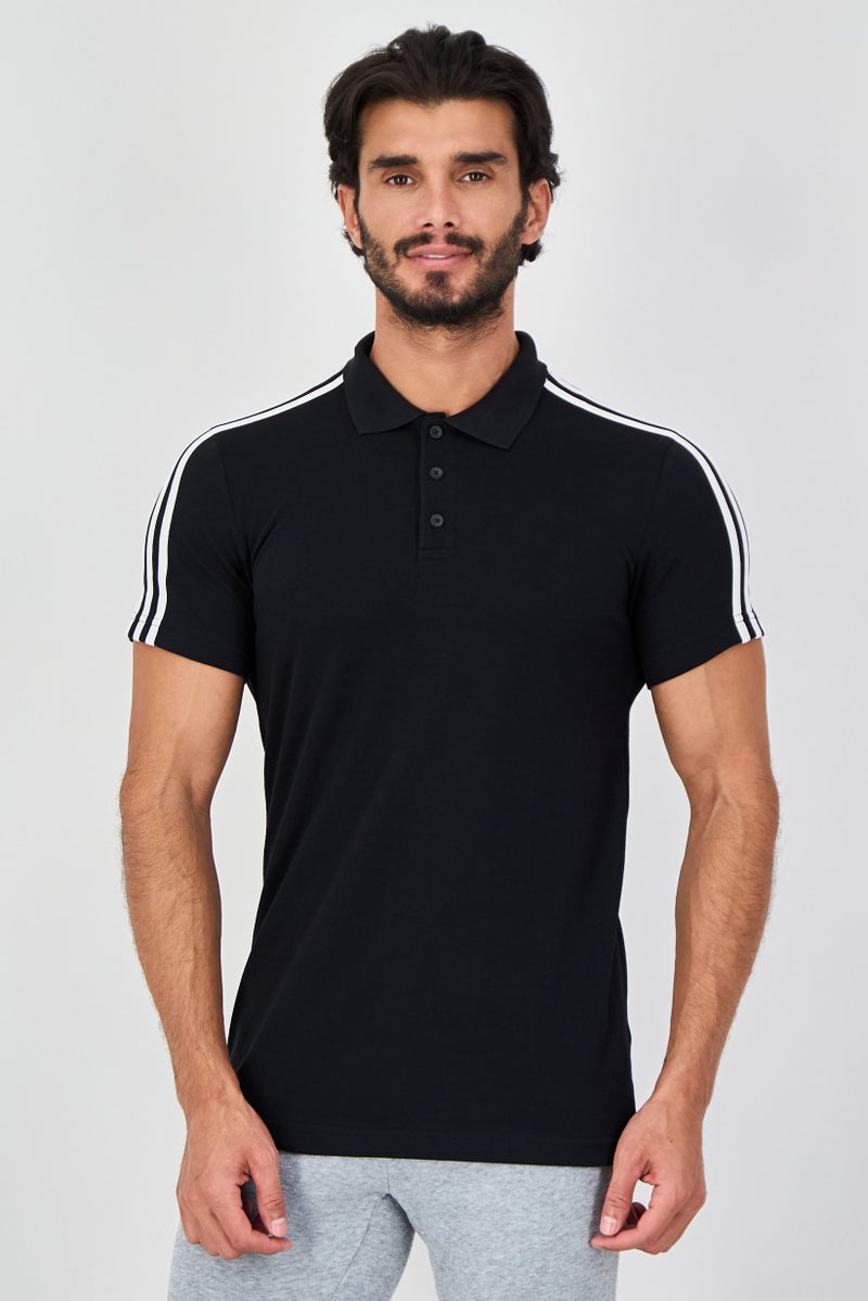 PUMA Men Sportswear Fit Short Sleeve Outdoor Polo Shirt, Black - Image 1