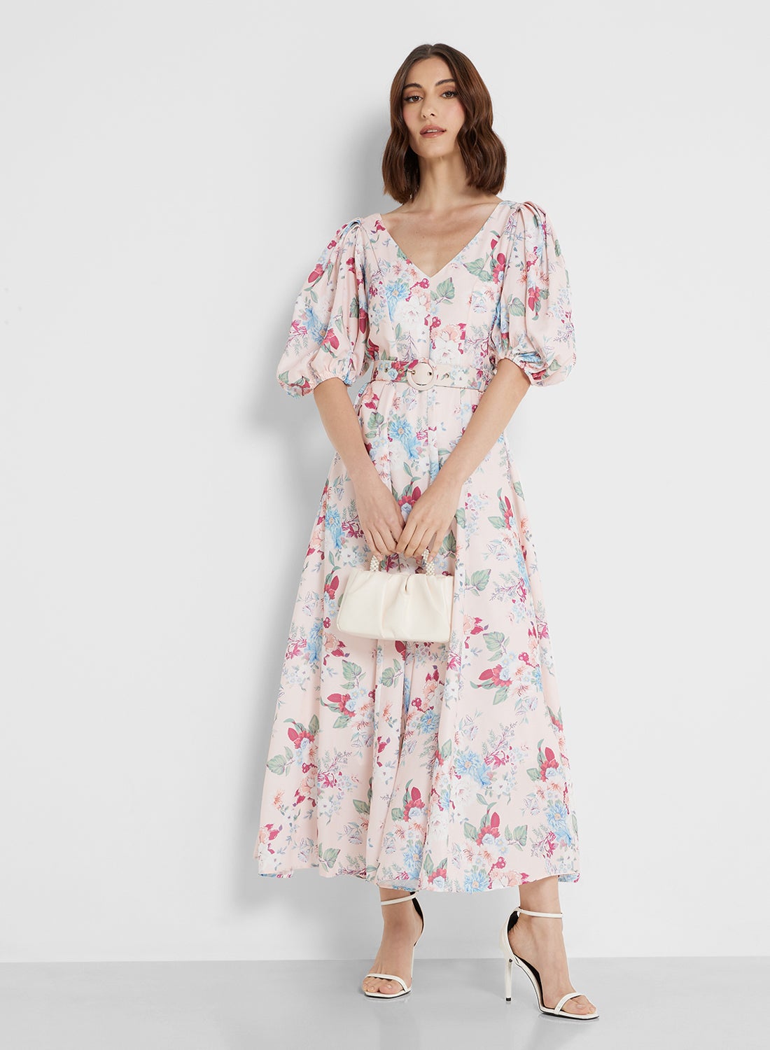 A dress with puffed sleeves and floral prints