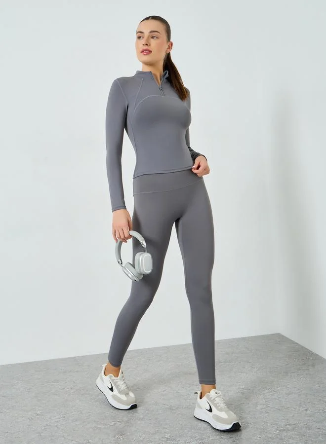 ستايلي اكتيف بلوزة بأكمام طويلة وسحاب جزئي وتفاصيل درزات