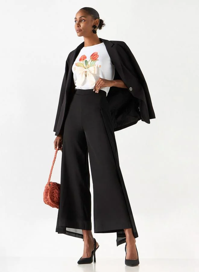 تواكستريمز تيشيرت دون أكمام بياقة ضيقة وطبعات من تو إكستريمز