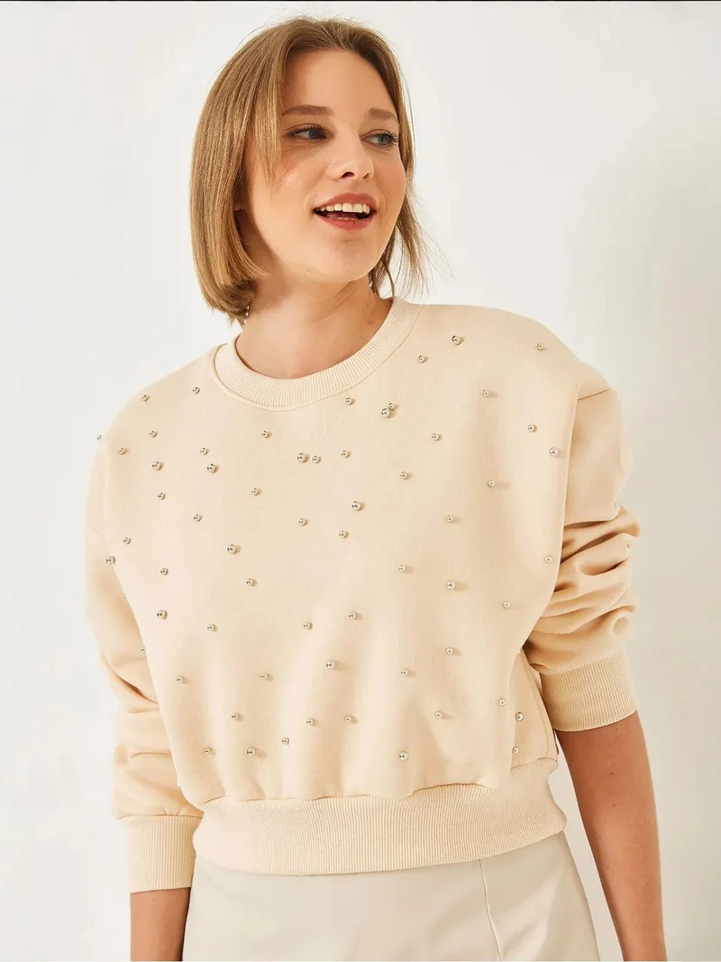 بيانكو لوتشي بلوفر  بياقة دائرية مزين بالكرات