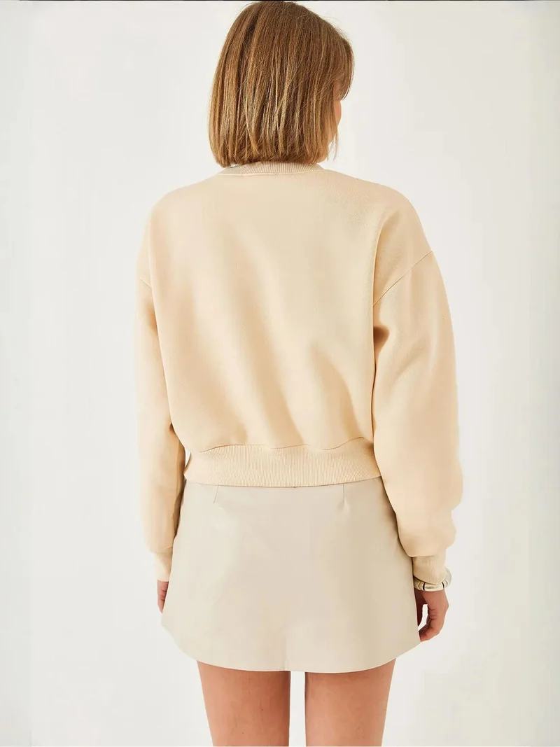 بيانكو لوتشي بلوفر  بياقة دائرية مزين بالكرات