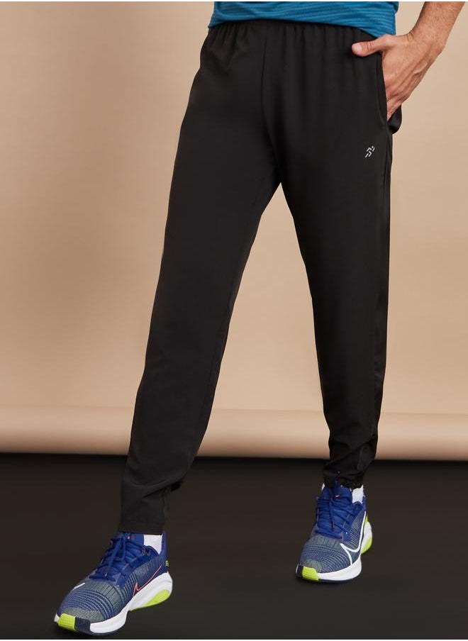 Styli Woven Running Track Pants with Zip Hem  - Image 1