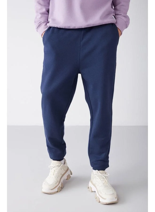 GRIMELANGE Jeremiah Men's Regular Fit Pants with Stretch Fabric, Waist Cord, and Elasticized Pockets, Navy Tracksuit Bottom.
