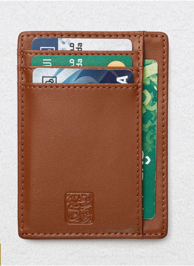 توقيع - محفظة كروت جلد بني بشعار السعودية السيفين والنخلة باللون الذهبي RFID - Image 1