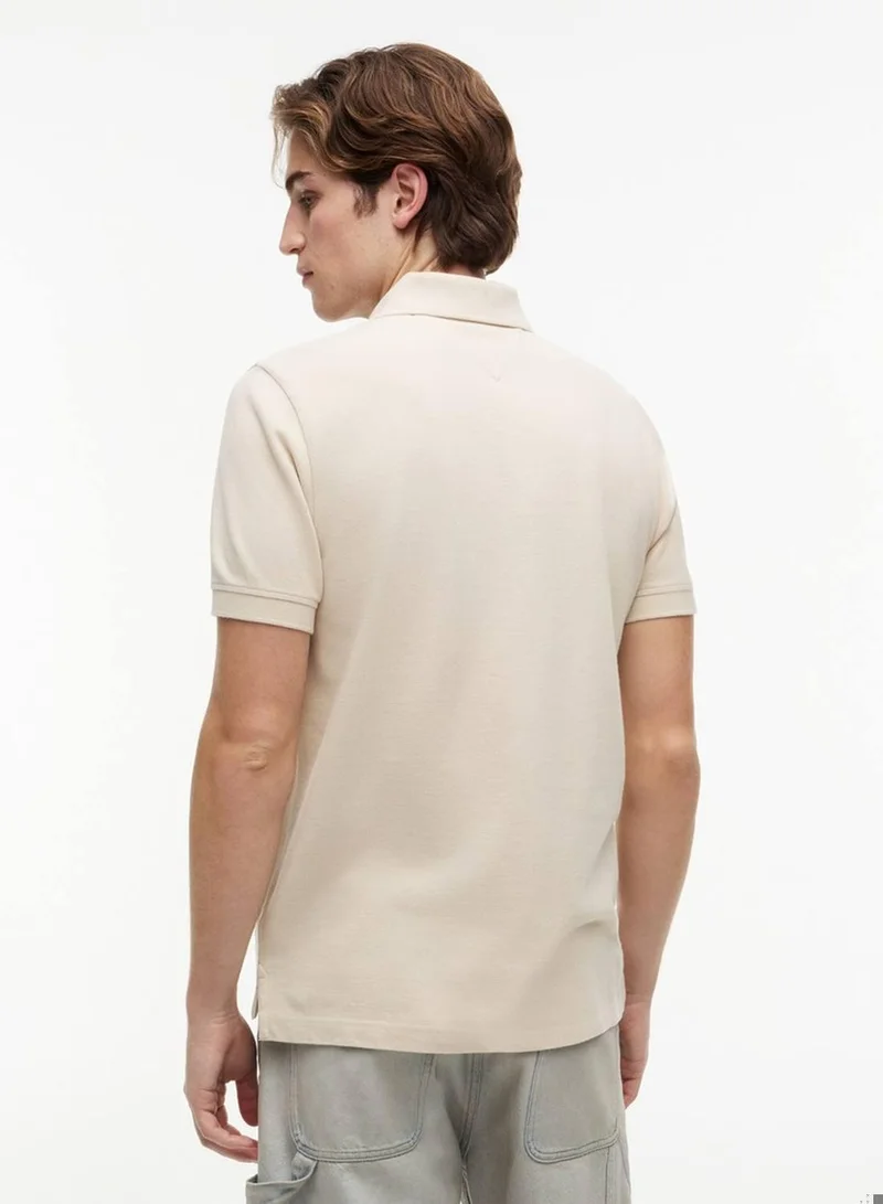 Tommy Jeans Classic Beige Essential Regular Fit Polo for Men | Best Price UAE