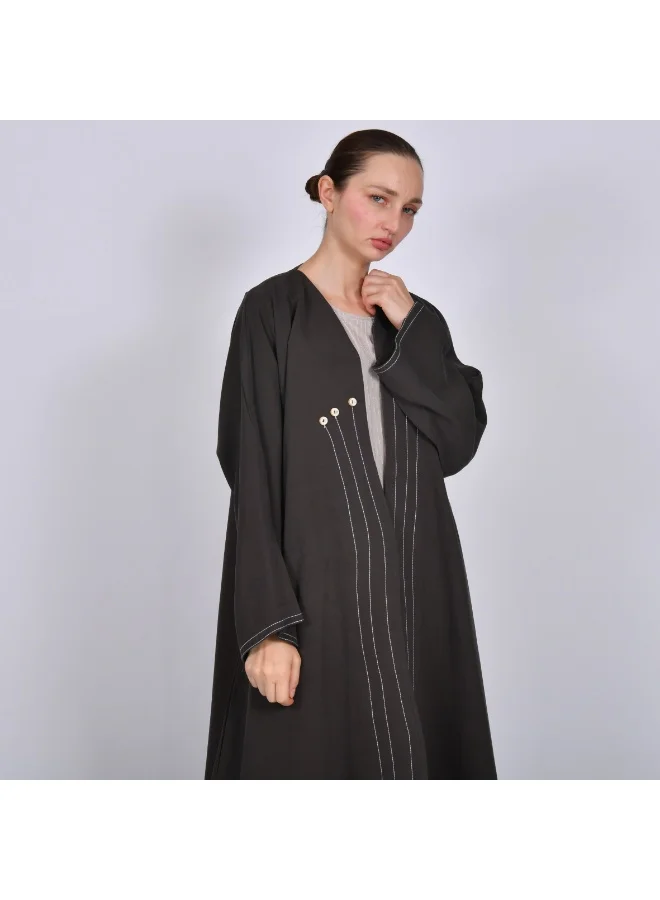 HAWRAA ABAYA Brown wrap abaya with a quarter-circle, flowing white embroidery and decorated with buttons