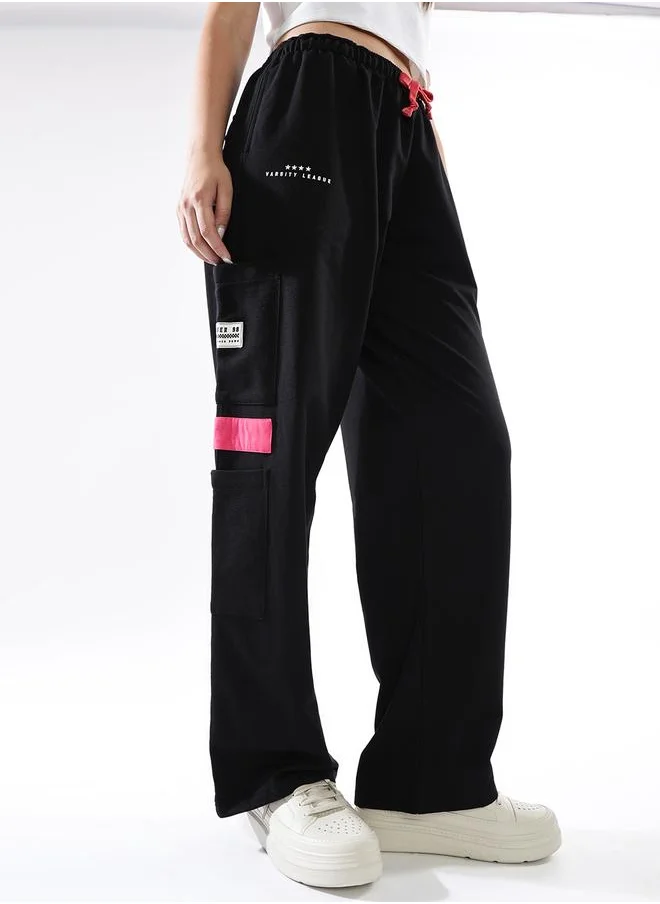 هوبرهولمي Women Track Pants in Black featuring Jogger fit with a printed pattern, no sleeves, regular length, secured with elasicated + drawstring closure, crafted from terry – crafted for those who appreciate style and comfort.