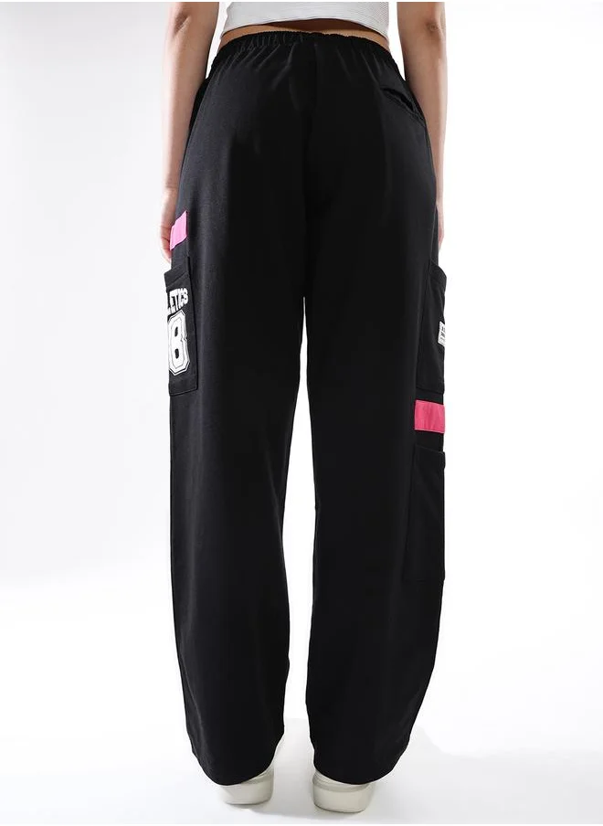 هوبرهولمي Women Track Pants in Black featuring Jogger fit with a printed pattern, no sleeves, regular length, secured with elasicated + drawstring closure, crafted from terry – crafted for those who appreciate style and comfort.
