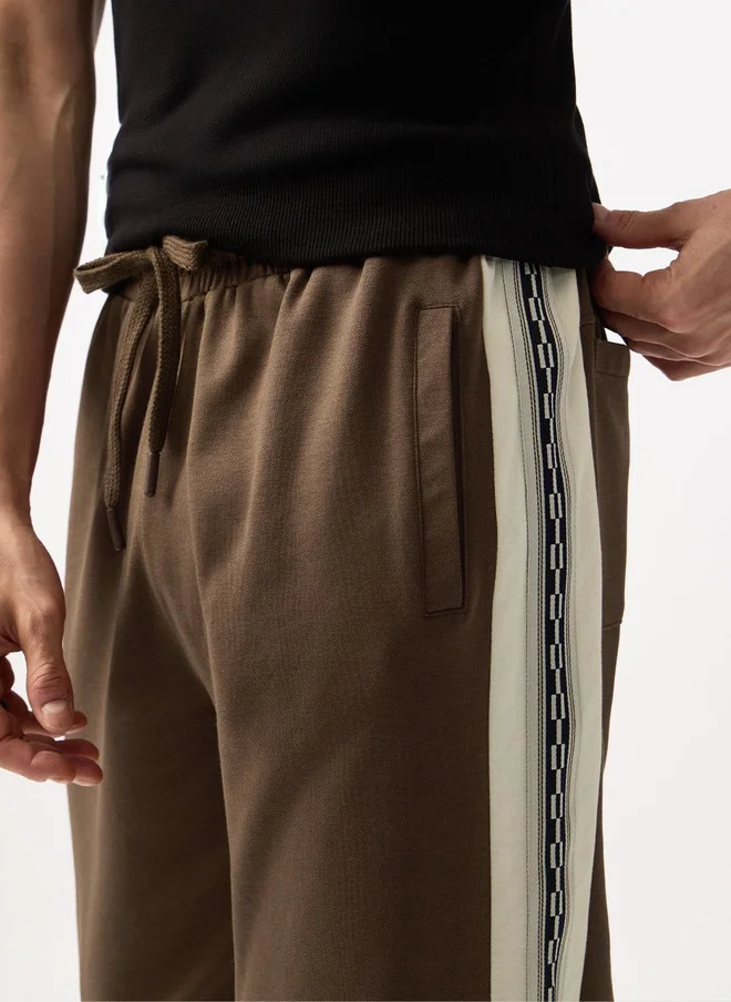 The Souled Store  The Souled Store Men Graphic Printed Straight Fit Joggers  | Best Price UAE