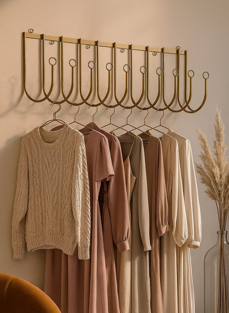 Wall-mounted clothes rack made of high-quality metal material, providing high rigidity and durability and ensuring its long-lasting use.