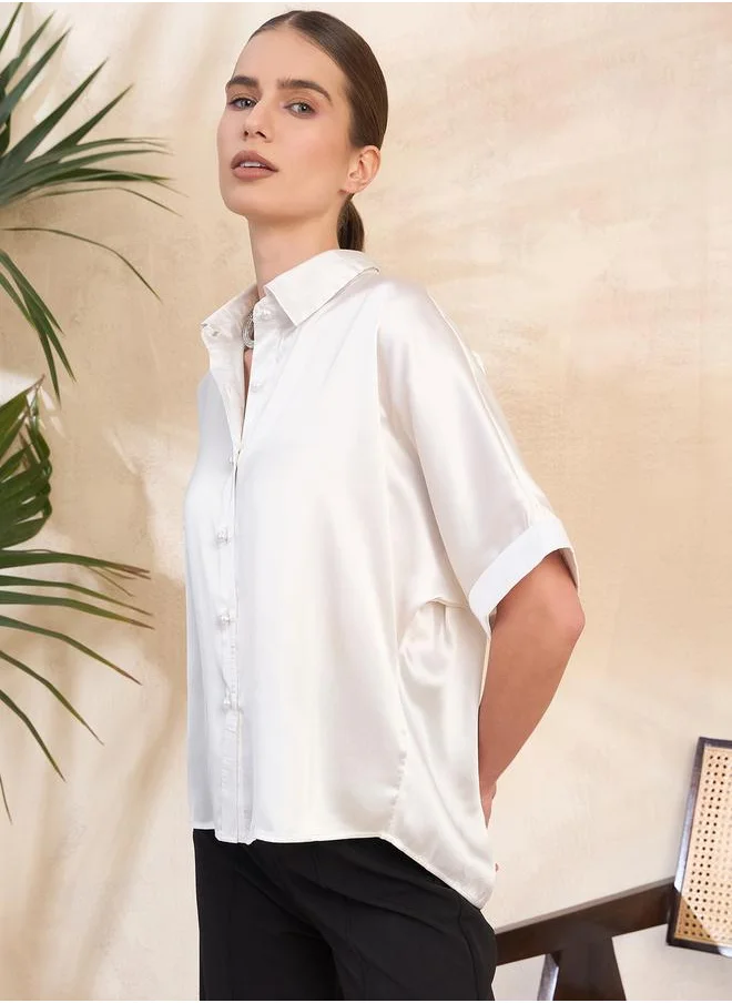 Kassually Cut-Out Pearl Embellished Satin Boxy Fit Shirt by Styli