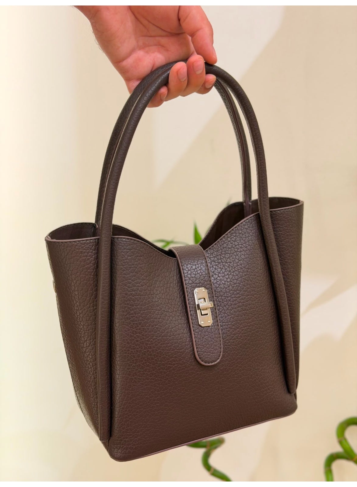 Women's handbag with adjustable handle