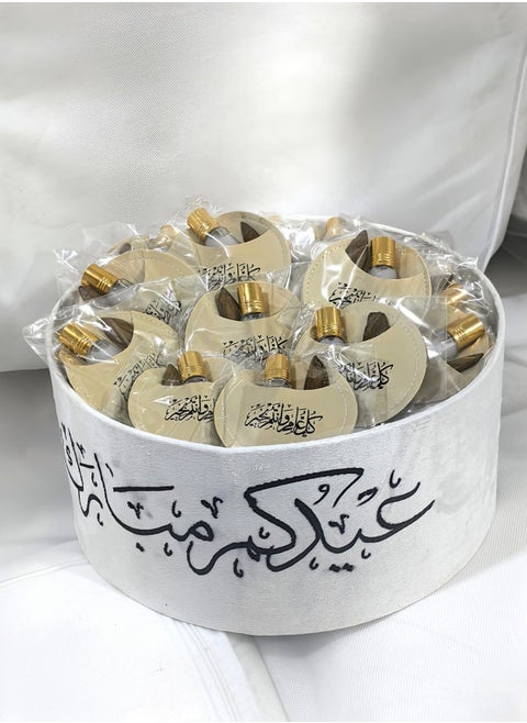 Eid gift box containing white musk and a luxurious oud piece for distribution and gifts