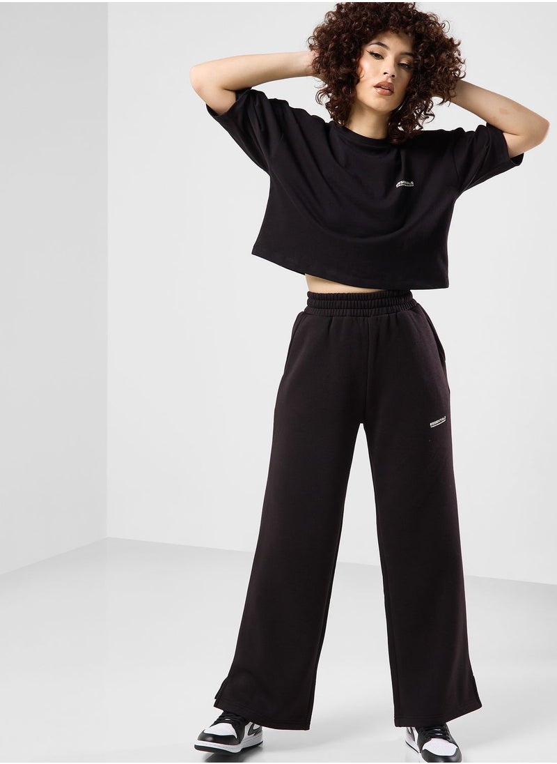 The Giving Movement - Wide Leg Logo Joggers - Image 1