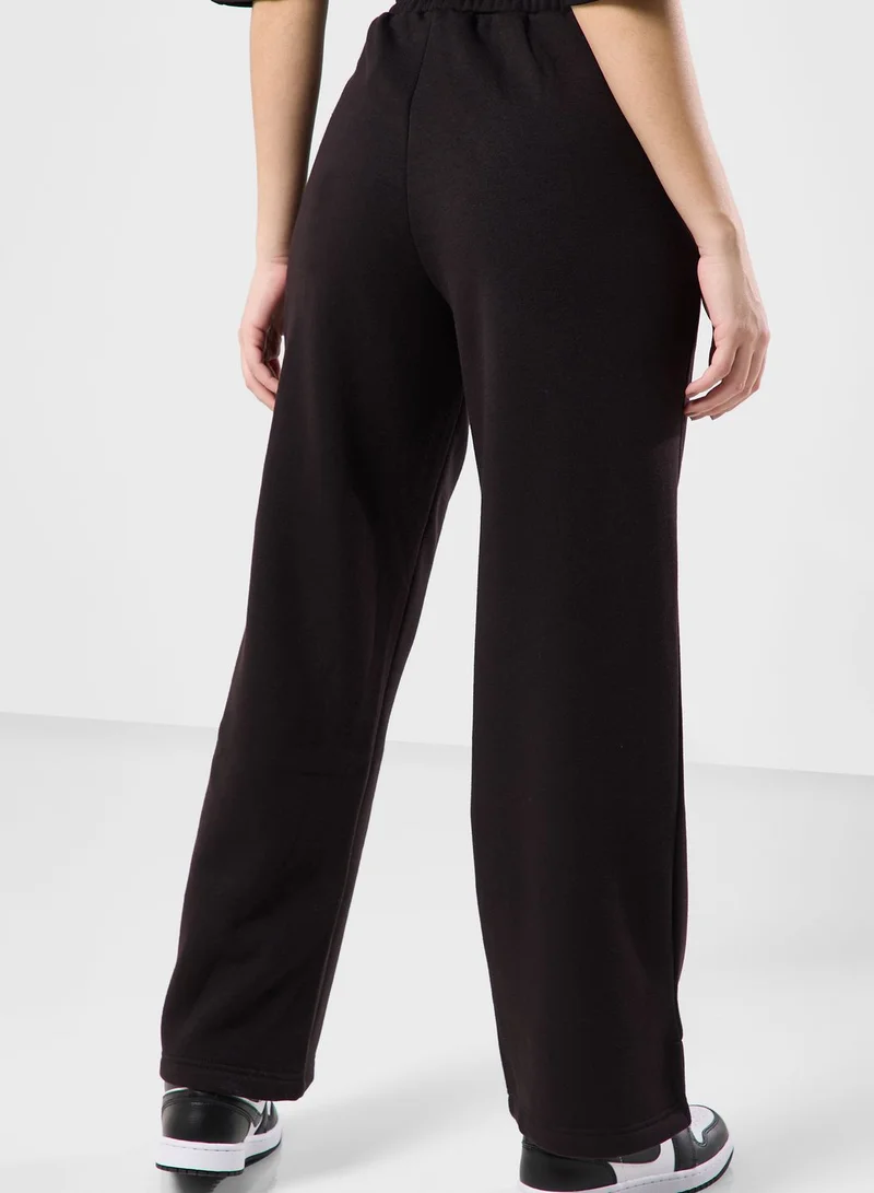 The Giving Movement Wide Leg Logo Joggers