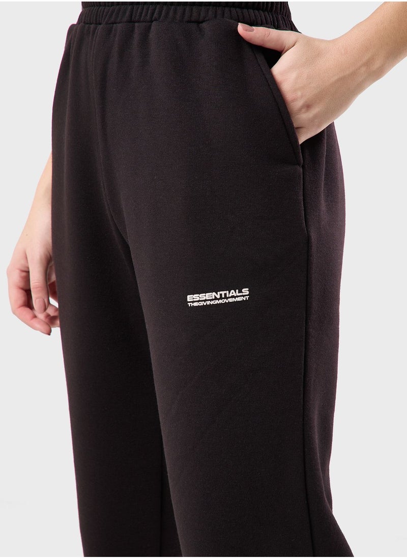 The Giving Movement - Wide Leg Logo Joggers - Image 1