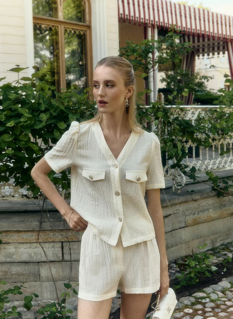 Lichi Short-sleeved blouse in textured fabric