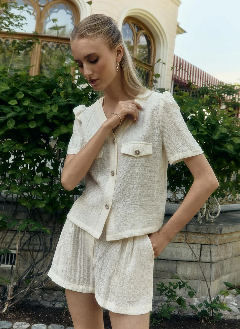 Lichi Short-sleeved blouse in textured fabric
