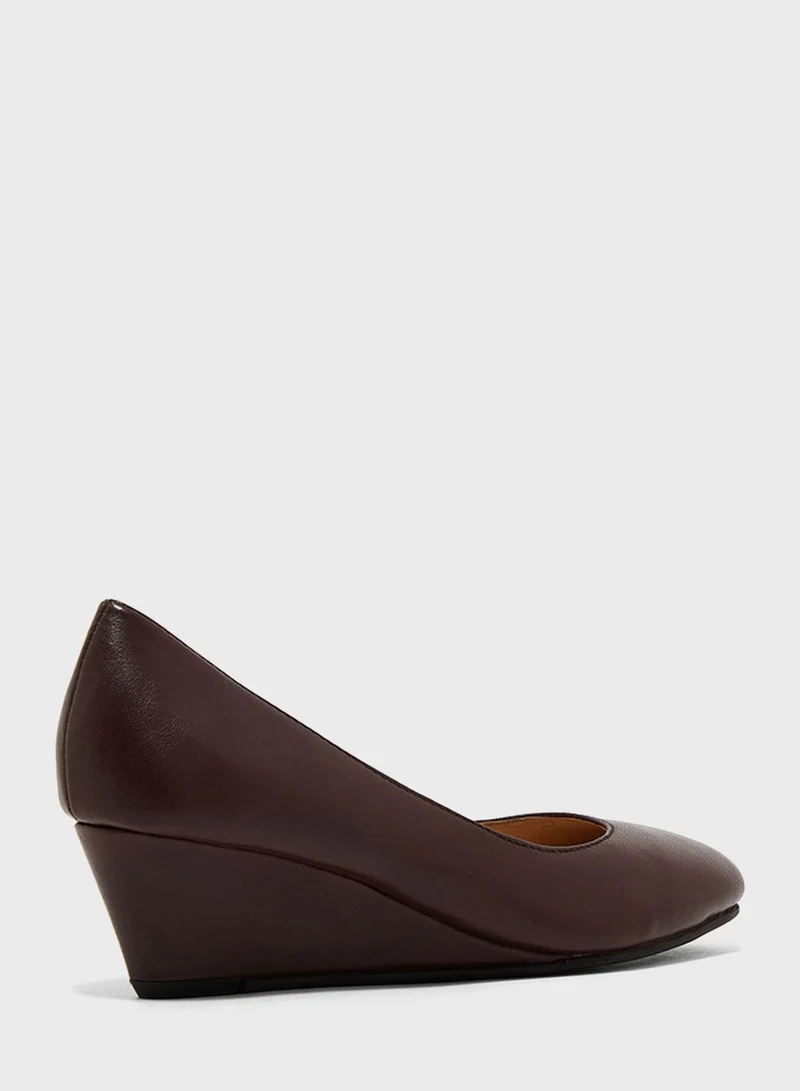 Hush Puppies Round Toe Wedge Pumps