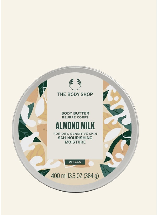 THE BODY SHOP زبدة الجسم بحليب اللوز | كريم غني بالرطوبة يدوم 96 ساعة للبشرة الجافة والحساسة | مع زبدة الشيا وزيت اللوز وزيت السمسم | العناية بالبشرة النباتية | 95% من أصل طبيعي | مرطب للجسم مهدئ غير دهني، 400 مل - Image 1