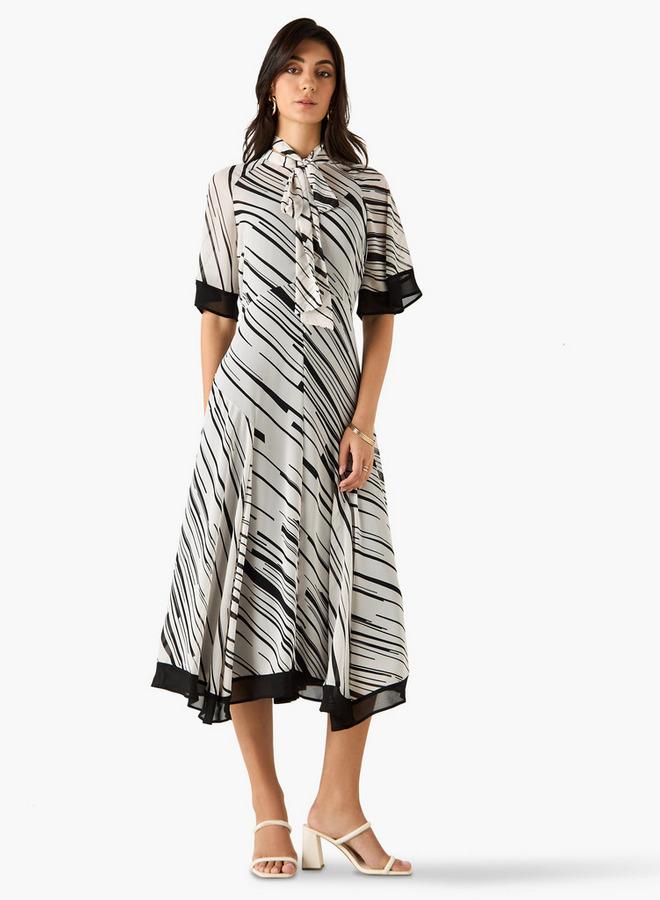 Iconic All-Over Print A-line Midi Dress with Pussy Bow Neck - Image 1