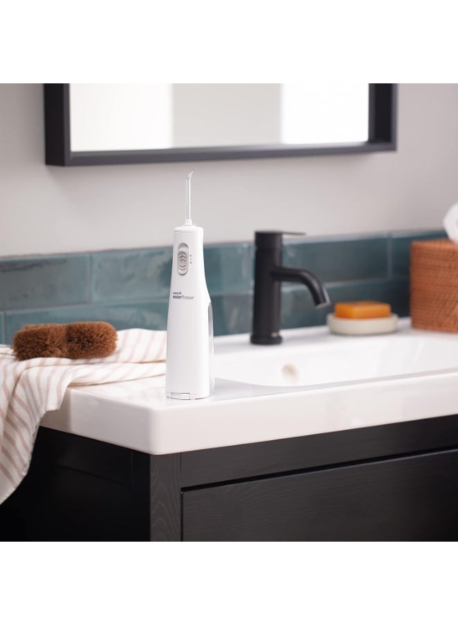 واتربيك جهاز تنظيف الأسنان بالماء من واتربيك بدون أسلاك، يعمل بالبطارية وقابل للحمل للسفر والمنزل، معتمد من جمعية طب الأسنان الأمريكية، مقاوم للماء للاستخدام أثناء الاستحمام، باللون الأبيض، قد يختلف التغليف. - Image 4