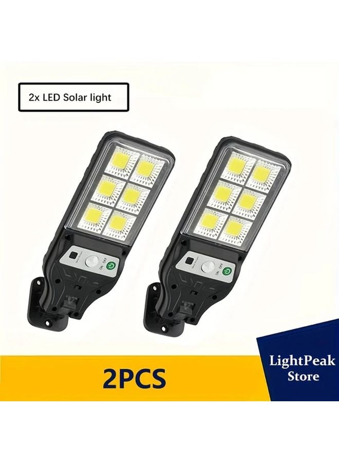 قطعتان من أضواء الجدار الشمسية الذكية للحركة، إضاءة ليد أمنية للخارج - Image 1