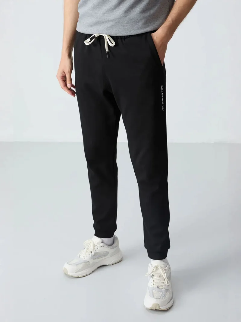 تومي لايف TOMMY Men's Oversized T-shirt And Pants Set