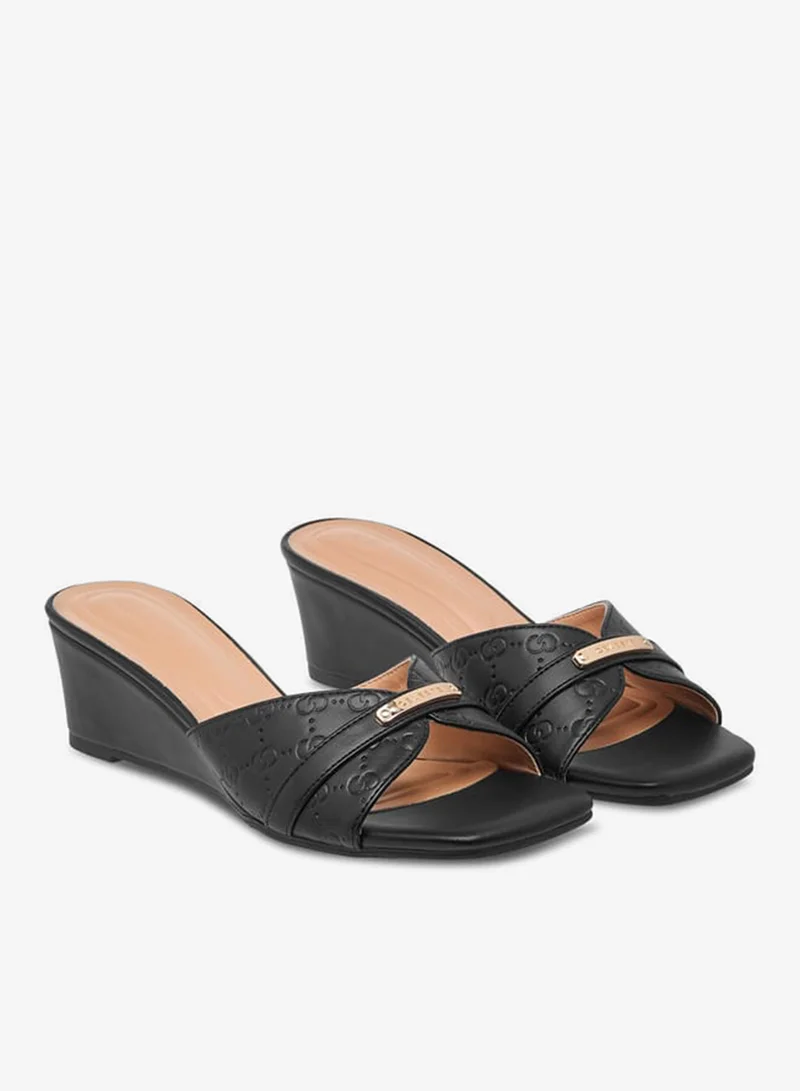 Celeste Women's Monogram Embossed Slip-On Sandals with Wedge Heels