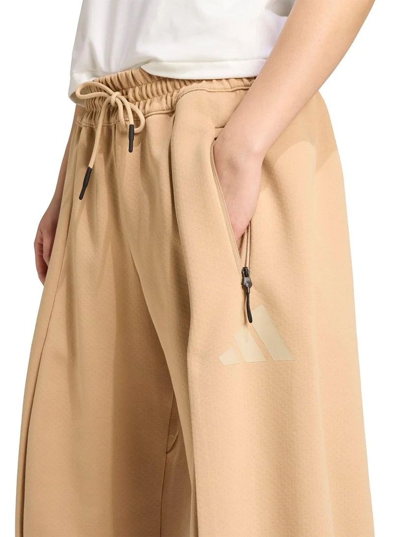 Adidas light beige Z.N.E. Open-Hem Tracksuit Bottoms for Women | Best Price UAE