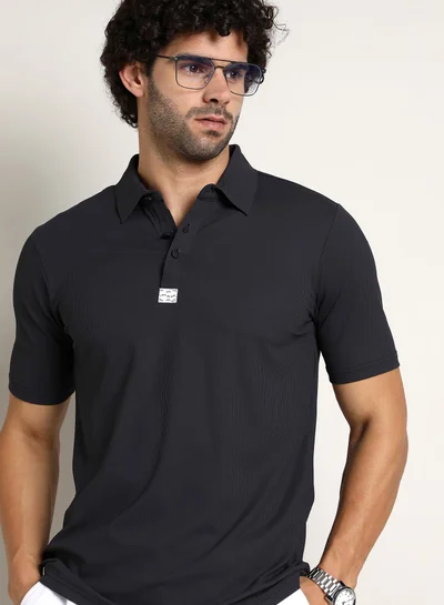 Campus Sutra Campus Sutra Men's Midnight Black Seamless Ribbed Polo T-Shirt For Casual Wear | Polo Neck | Short Regular Sleeves | Half-Button Closure | T-Shirt Crafted With Comfort Fit For Everyday Wear
