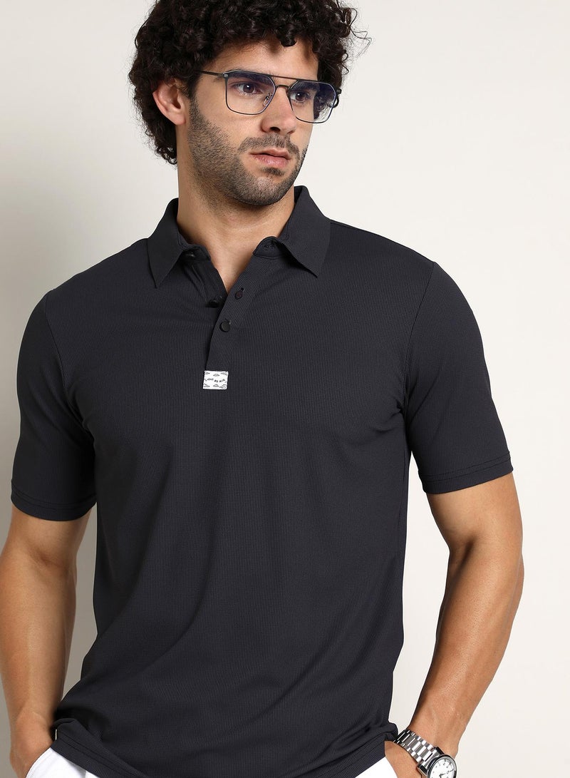 Campus Sutra Campus Sutra Men's Midnight Black Seamless Ribbed Polo T-Shirt For Casual Wear | Polo Neck | Short Regular Sleeves | Half-Button Closure | T-Shirt Crafted With Comfort Fit For Everyday Wear - Image 1