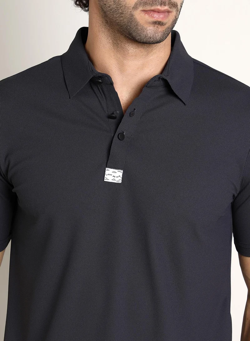 Campus Sutra Campus Sutra Men's Midnight Black Seamless Ribbed Polo T-Shirt For Casual Wear | Polo Neck | Short Regular Sleeves | Half-Button Closure | T-Shirt Crafted With Comfort Fit For Everyday Wear