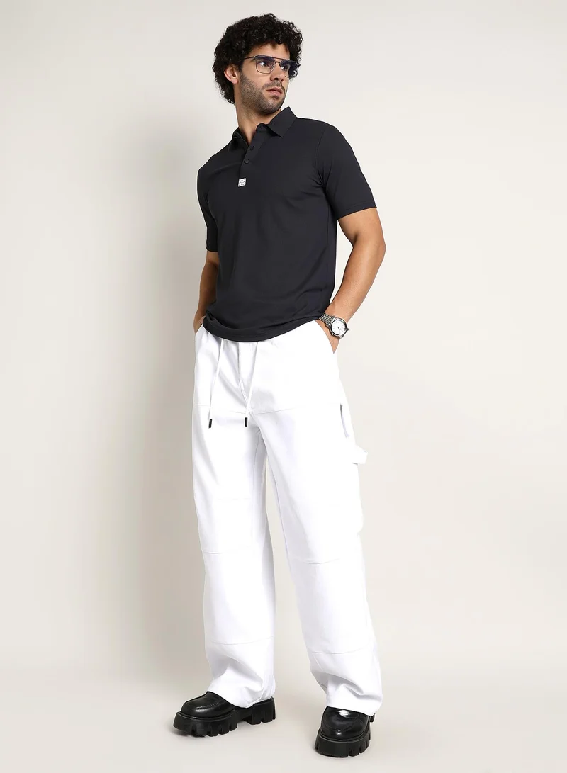 Campus Sutra Campus Sutra Men's Midnight Black Seamless Ribbed Polo T-Shirt For Casual Wear | Polo Neck | Short Regular Sleeves | Half-Button Closure | T-Shirt Crafted With Comfort Fit For Everyday Wear