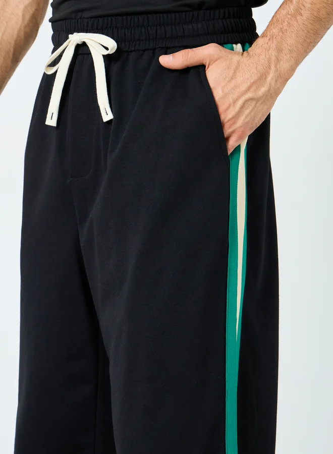 Styli Styli Relaxed Fit Open Hem Joggers with Side Tape and Badge Detail