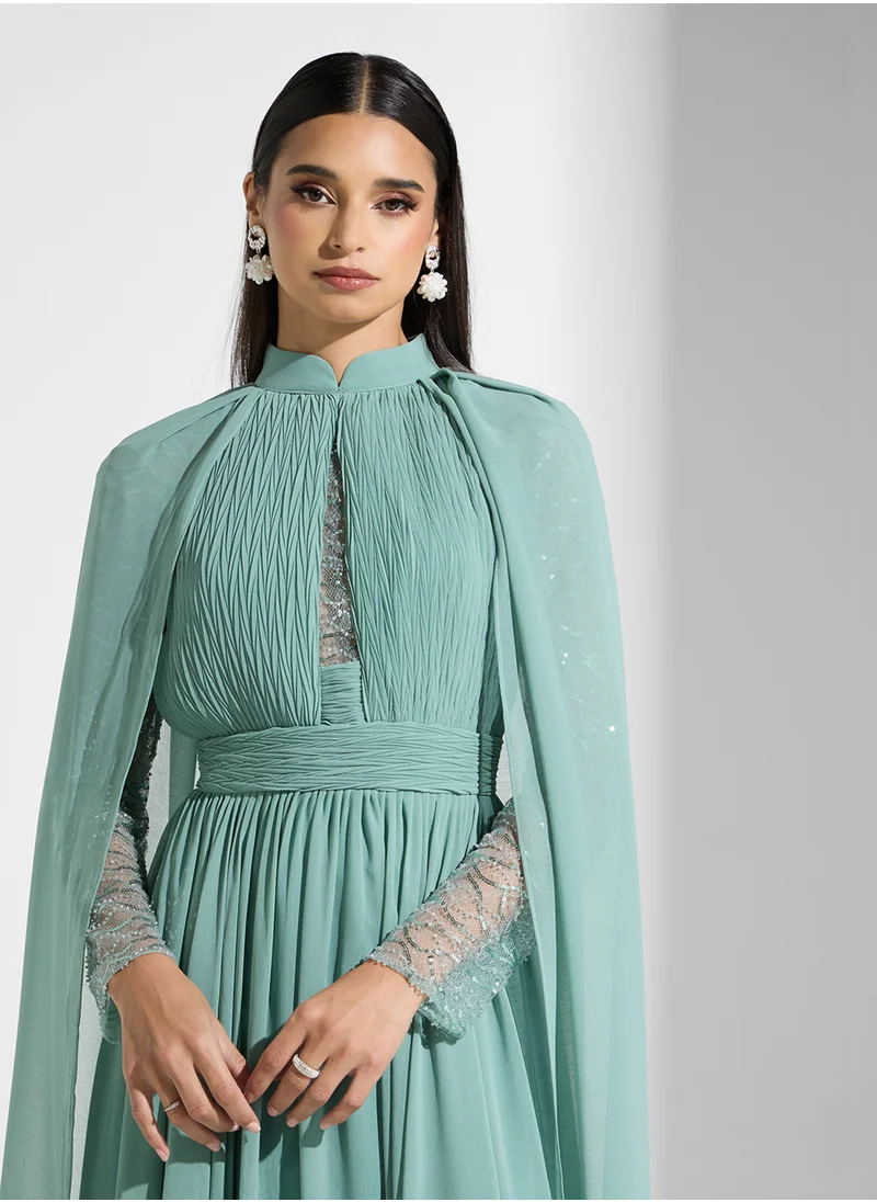 Namshi x Shimmer Sleeve Dress With Cape