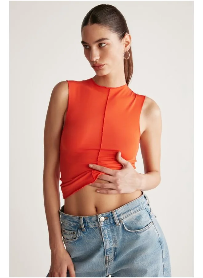 GRIMELANGE Grimelange Ginny Women's Sandy Stretch Fabric Open Hem Bodycon Sleeveless Coral Blouse