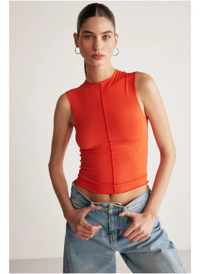 GRIMELANGE Grimelange Ginny Women's Sandy Stretch Fabric Open Hem Bodycon Sleeveless Coral Blouse