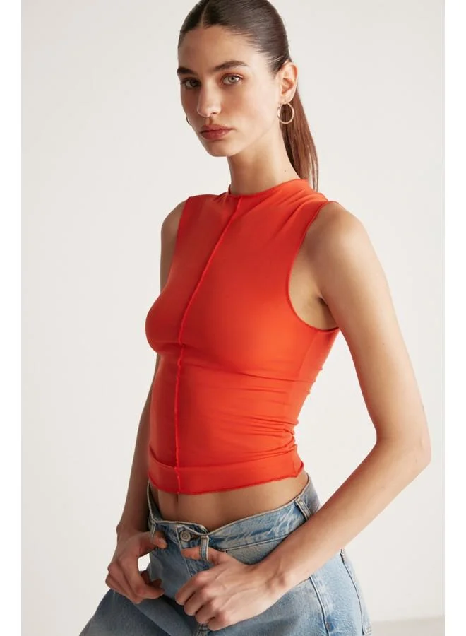GRIMELANGE Grimelange Ginny Women's Sandy Stretch Fabric Open Hem Bodycon Sleeveless Coral Blouse