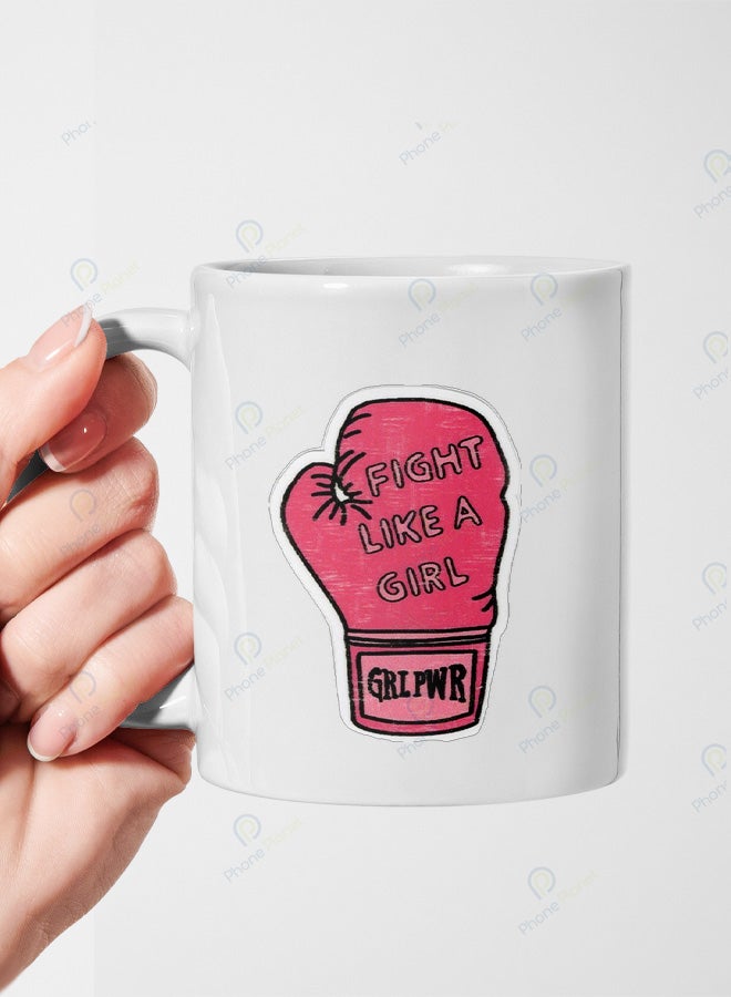 A ceramic mug printed with the phrase Fight like a girl and featuring a comfortable handle