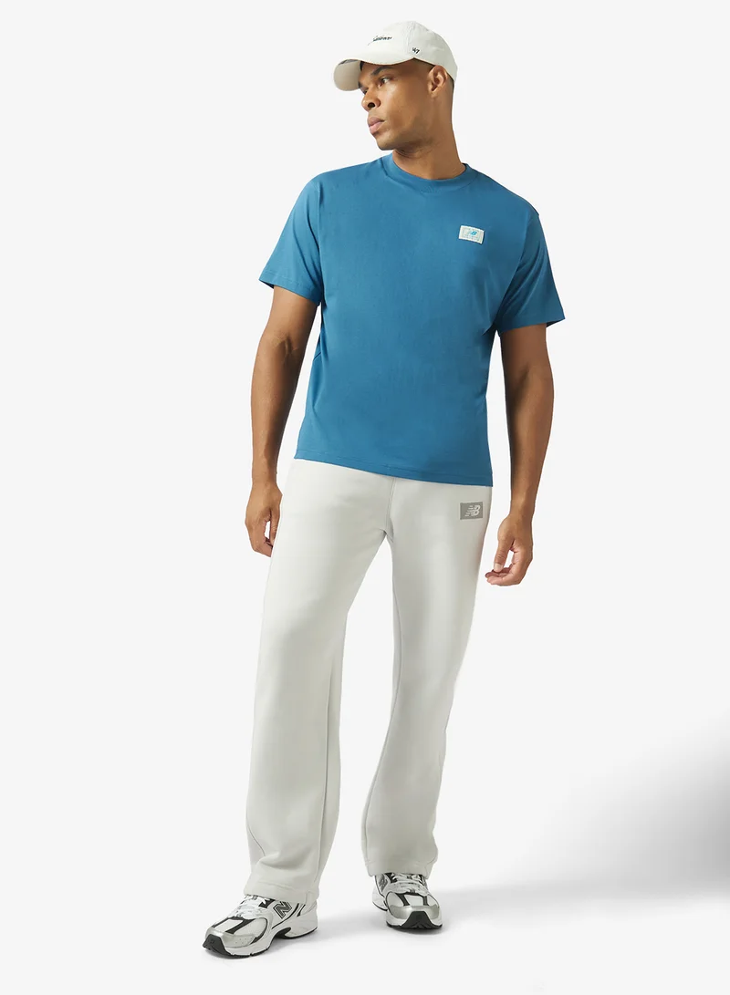New Balance STREAMSONG (STS) Woven Label T-Shirt for Men | Best Price UAE