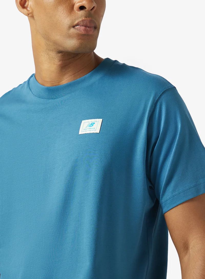 New Balance STREAMSONG (STS) Woven Label T-Shirt for Men | Best Price UAE