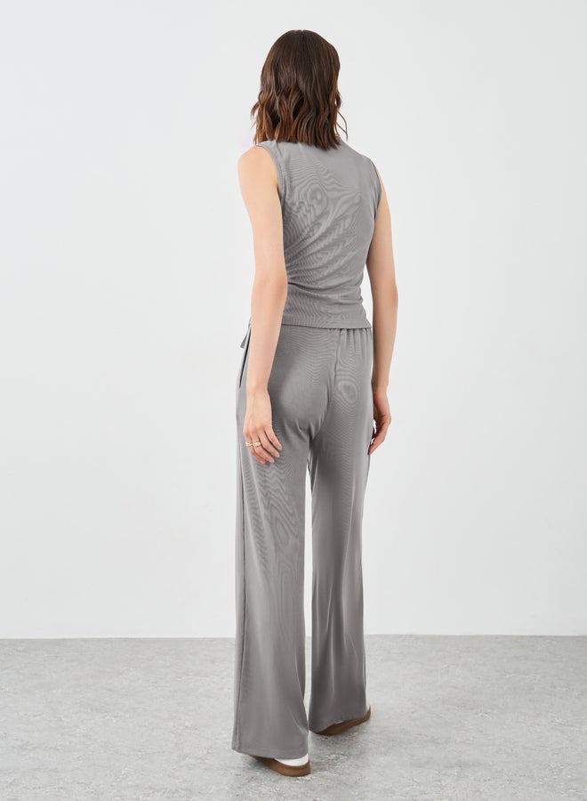 تايك تو طقم بلوزة بلا أكمام بخصر مربوط وسروال مستقيم - Image 5