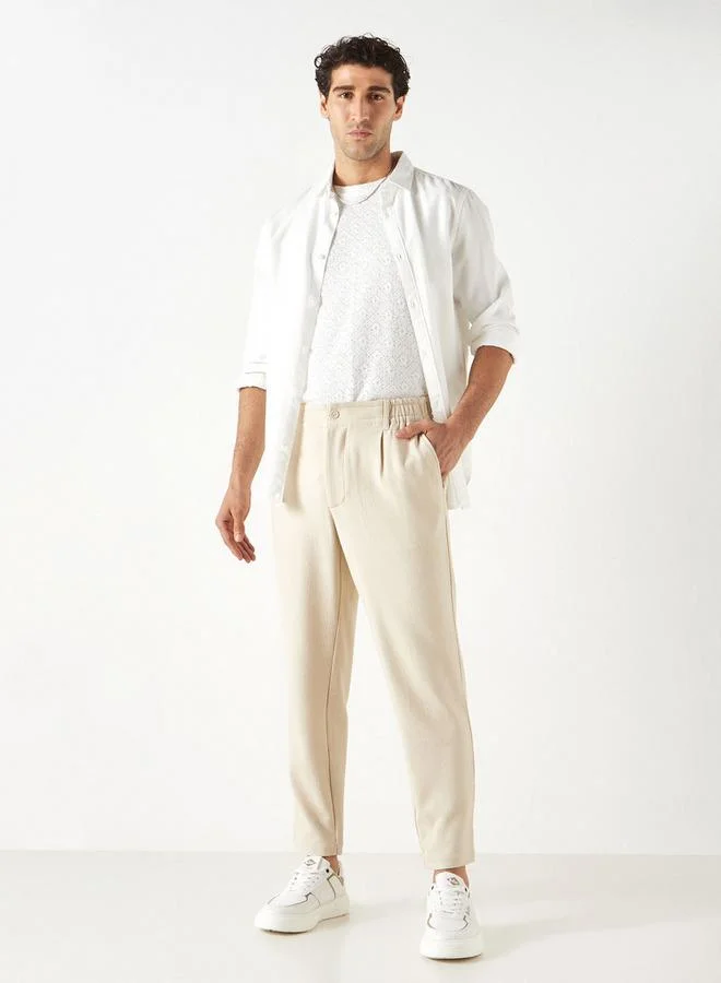 ايكونيك بنطلون سادة بِخصر مرن وقصّة عادية من آيكونيك