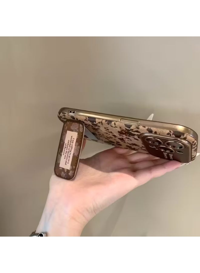 تيمو جراب موبايل بنقشة زهور بنية انيقة مع اطار ذهبي وستاند خلفي لتثبيت الموبايل خامة الجراب متينة تحمي الموبايل من الصدمات والخدوش متوافق مع ايفون 17 بروماكس - Image 2