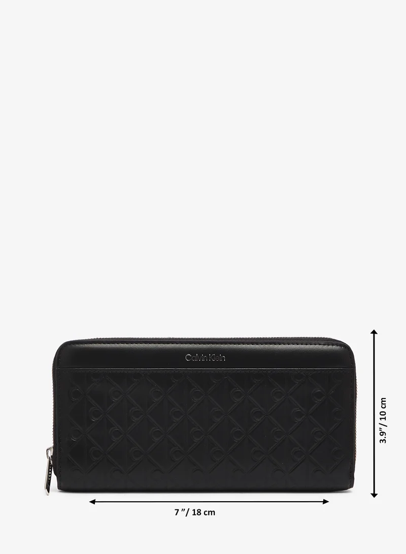 CALVIN KLEIN  Embossed Aop Long Zip Around Wallet for Women | Best Price UAE