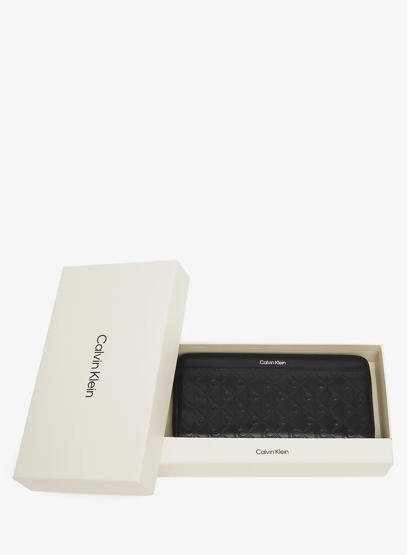 CALVIN KLEIN  Embossed Aop Long Zip Around Wallet for Women | Best Price UAE