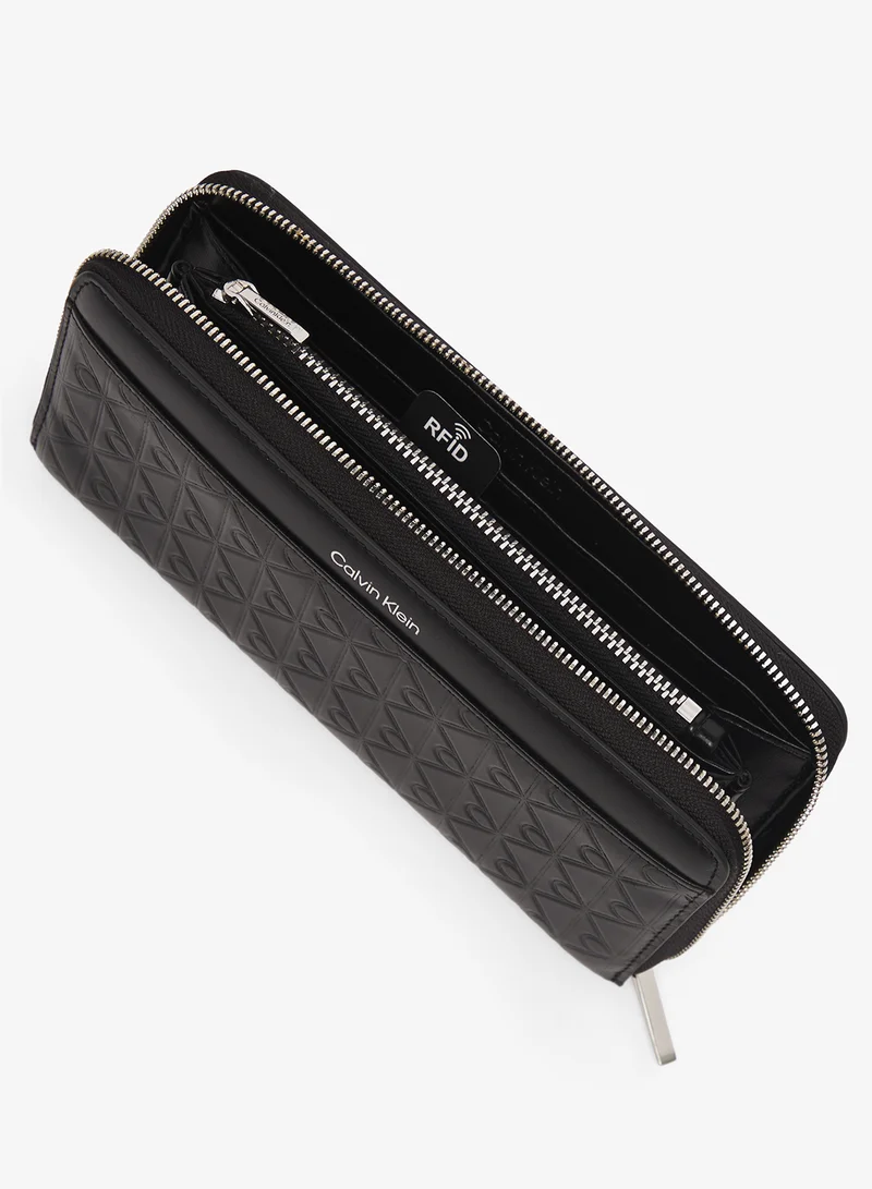 CALVIN KLEIN  Embossed Aop Long Zip Around Wallet for Women | Best Price UAE